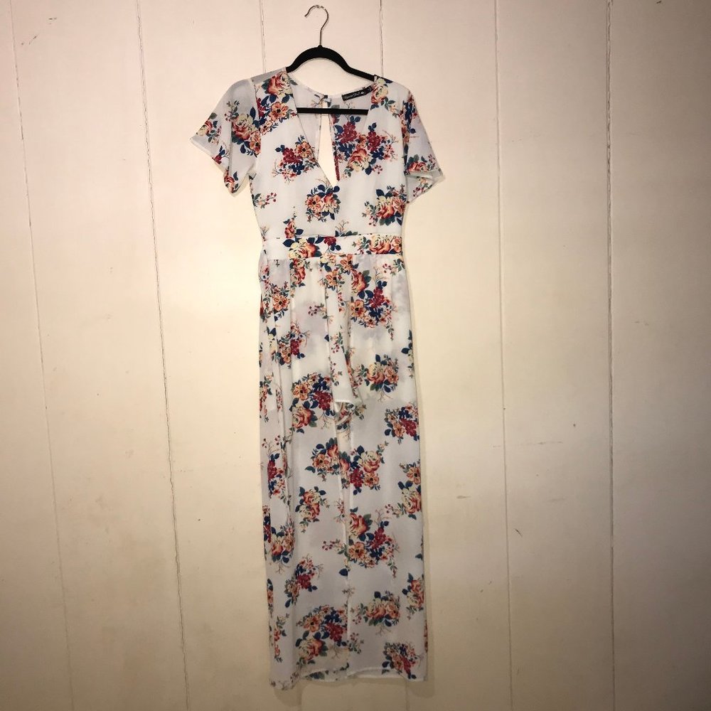 White floral romper with a trail